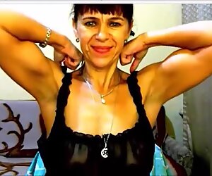 Russian MILF flexes her good biceps on cam